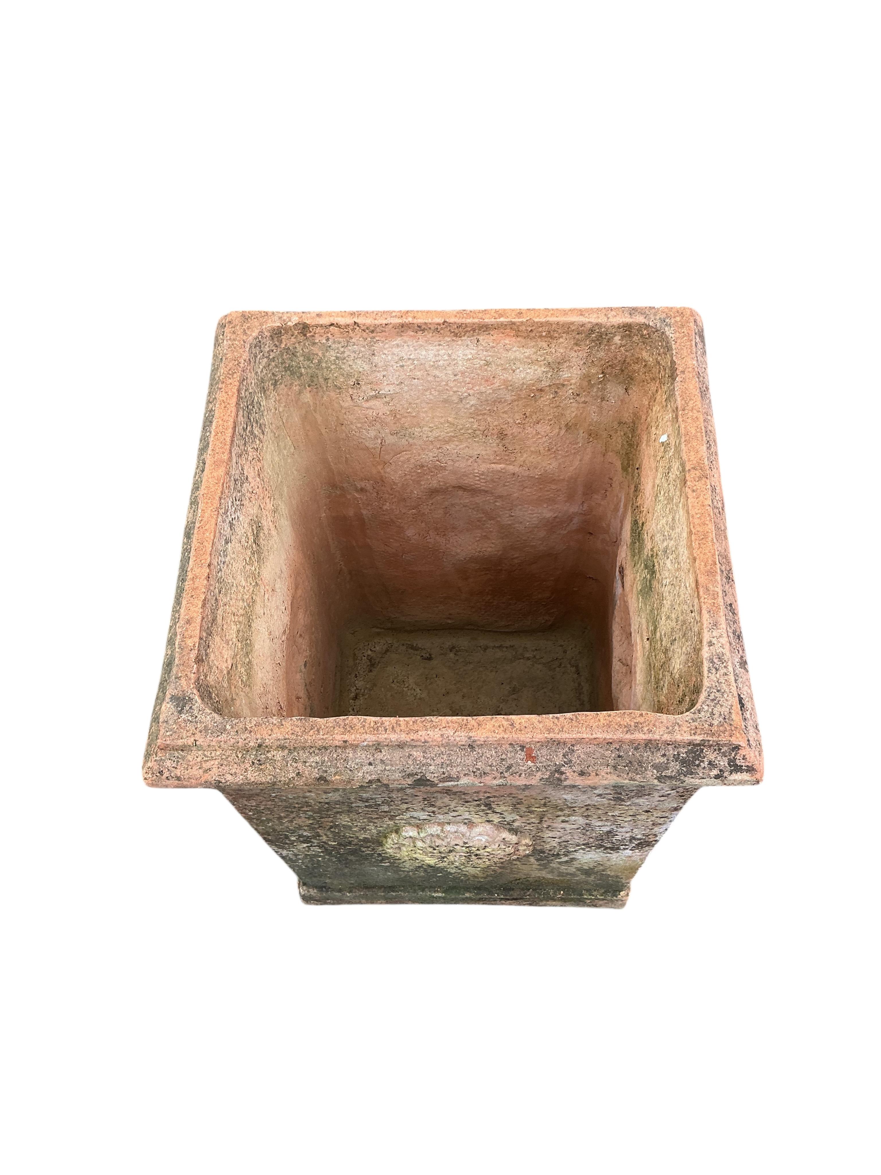 A large square terracotta garden planter, width 46cm, height 64cm